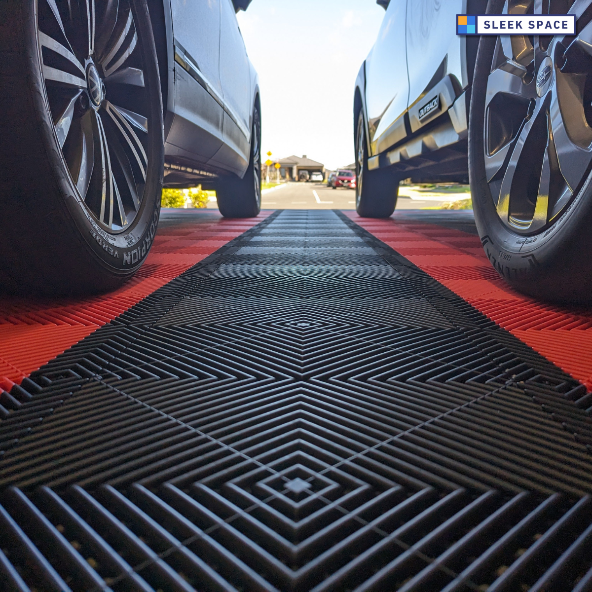 Rosso Red and Jet Black ULTRAGRID garage tiles with 2 cars on top