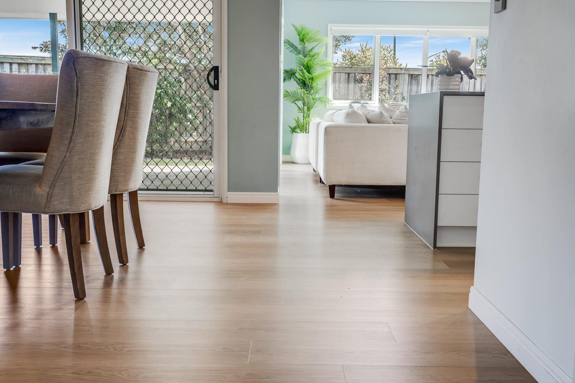 Light Oak 8mm Flooring in a well lit living room
